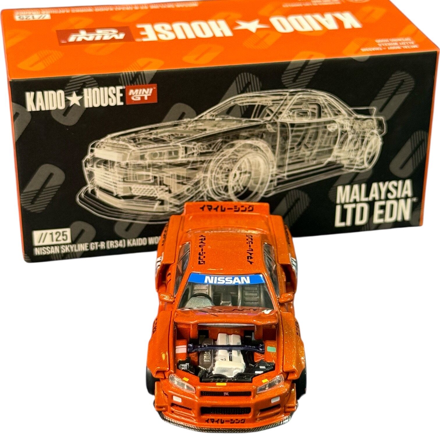 Mini GT x Kaido //125 Nissan Skyline GT-R (R34) Kaido Works Katsura Orange Kaido House Exclusive KHMG125